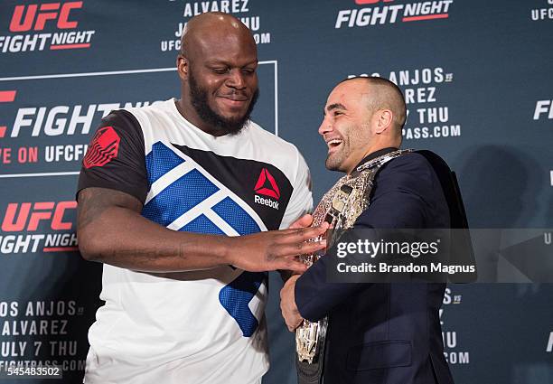 Derrick Lewis touches Eddie Alvarez's belt at the post fight press conference inside the MGM Grand Garden Arena on July 8, 2016 in Las Vegas, Nevada.