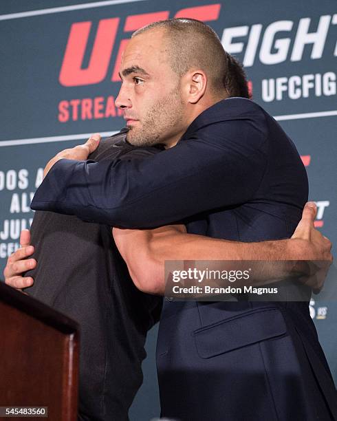 Eddie Alvarez hugs Rafael Dos Anjos of Brazil at the post fight press conference inside the MGM Grand Garden Arena on July 8, 2016 in Las Vegas,...