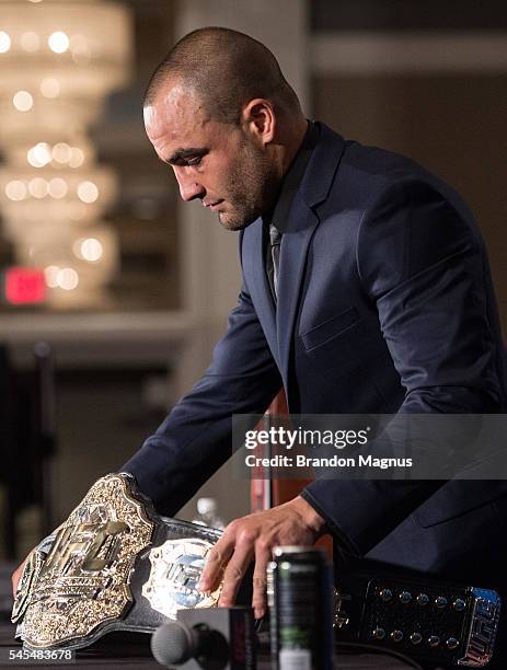 Eddie Alvarez puts down his belt after defeating Rafael Dos Anjos of Brazil in their lightweight championship bout during the UFC Fight Night event...