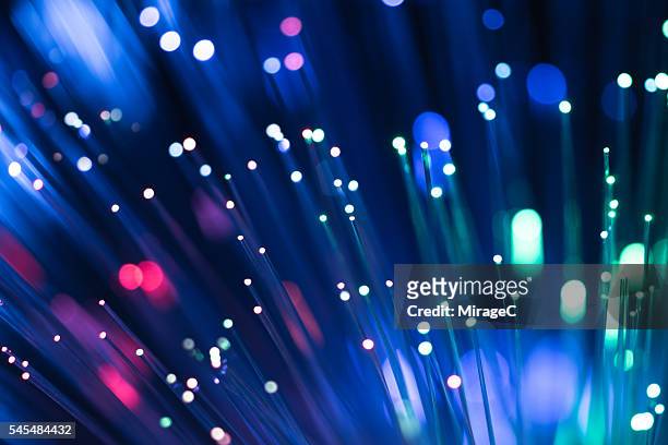 fiber optics rgb color illuminated - computer network stock-fotos und bilder