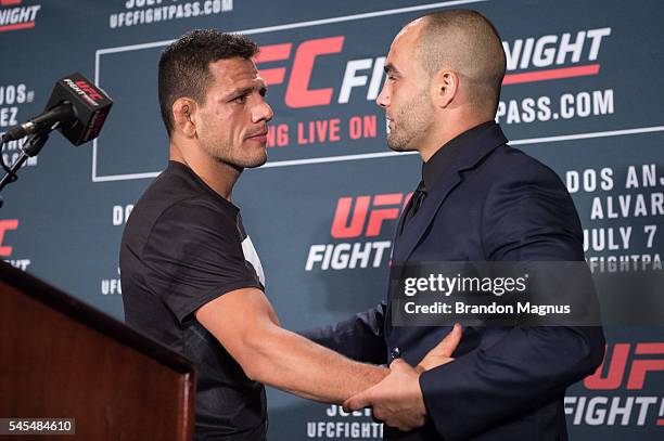 Eddie Alvarez hugs Rafael Dos Anjos of Brazil at the post fight press conference inside the MGM Grand Garden Arena on July 8, 2016 in Las Vegas,...