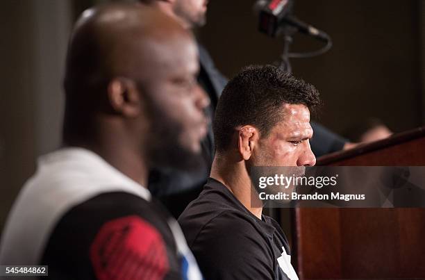 Rafael Dos Anjos of Brazil and Derrick Lewis speak to the media at the post fight press conference inside the MGM Grand Garden Arena on July 8, 2016...