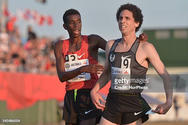 Canadian National Record holder, Mohammed Ahmed celebrates with Cameron Levins, after winning the 5000 metres final, at the opening day of the 2016...