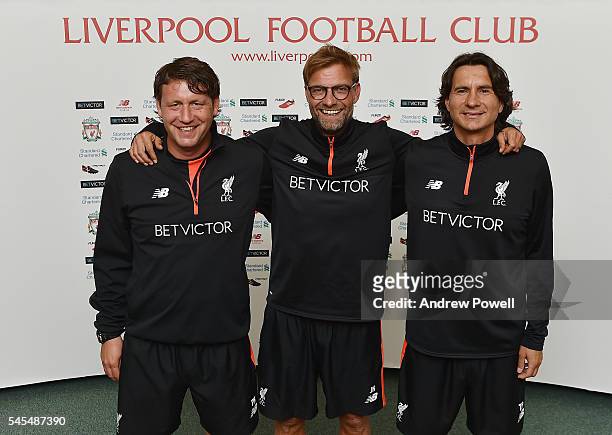 Second assistant coach of Liverpool Peter Krawietz, Manager of Liverpool Jurgen Klopp and first assistant coach of Liverpool Zeljko Buvac pose for a...