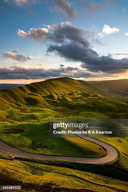 curvy road below rushup edge, derbyshire, england - derbyshire stock pictures, royalty-free photos & images