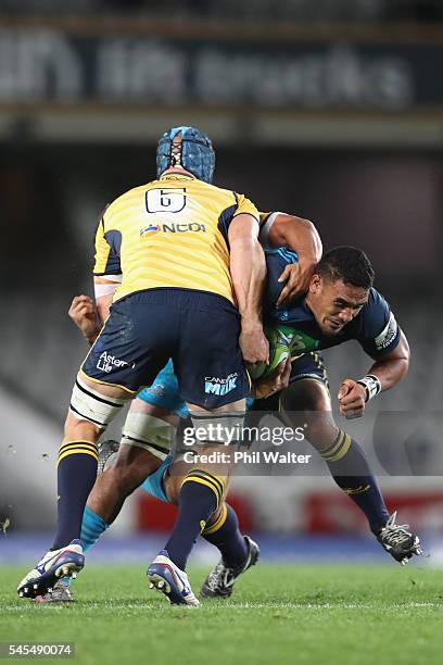 Jerome Kaiuno of the Blues is tackled during the round 16 Super Rugby match between the Blues and the Brumbies at Eden Park on July 8, 2016 in...