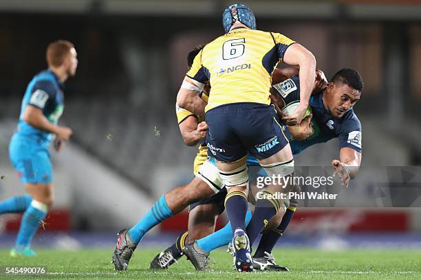 Jerome Kaiuno of the Blues is tackled during the round 16 Super Rugby match between the Blues and the Brumbies at Eden Park on July 8, 2016 in...