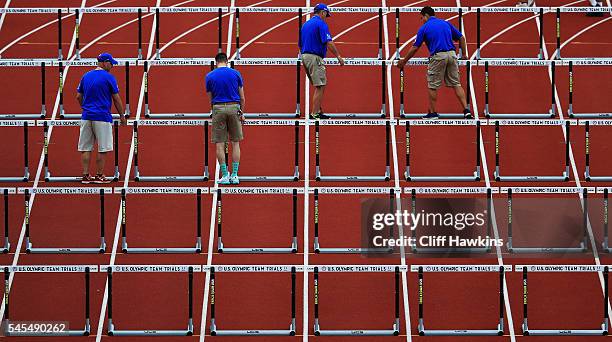 Hurdles are reset in the first round of the Women's 100 Meter Hurdles during the 2016 U.S. Olympic Track & Field Team Trials at Hayward Field on July...