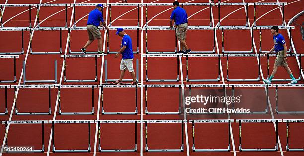 Hurdles are reset in the first round of the Women's 100 Meter Hurdles during the 2016 U.S. Olympic Track & Field Team Trials at Hayward Field on July...