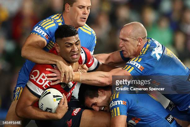 Daniel Tupou of the Roosters is tackled during the round 18 NRL match between the Parramatta Eels and the Sydney Roosters at Pirtek Stadium on July...