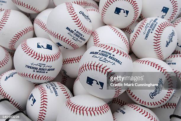 Detailed view of a group of Rawlings official Major League baseballs with the stamped signature of Baseball Commissioner Robert D. Manfred Jr. Shown...