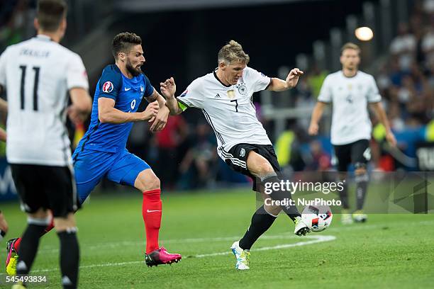 Bastian Schweinsteiger, Olivier Giroud during the UEFA EURO semi final match between Germany and France at Stade Velodrome on July 7, 2016 in...