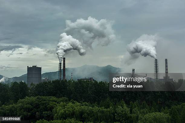 smoke emitting from industry against sky,hangzhou,china - coal pollution stock pictures, royalty-free photos & images