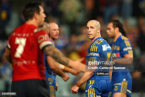 Jeff Robson of the Eels looks at Mitchell Pearce of the Roosters appeal a decision during the round 18 NRL match between the Parramatta Eels and the...
