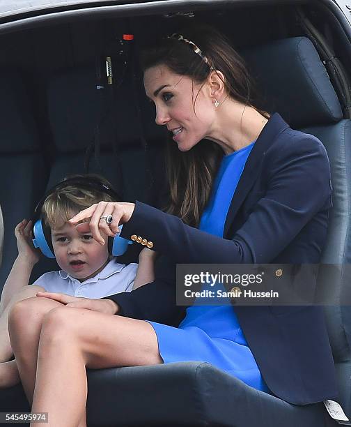 Catherine, Duchess of Cambridge and Prince George of Cambridge sit in a helicopter attend the The Royal International Air Tattoo at RAF Fairford on...