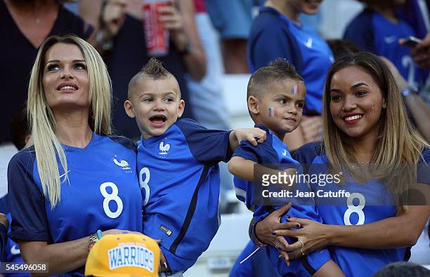 Ludivine Payet, wife of Dimitri Payet and their sons Milan Payet and Noa Payet attend the UEFA Euro 2016 semi-final match between Germany and France...