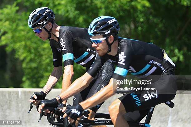 Chris Froome of Great Britain and Team SKY rides with team mate Luke Rowe of Great Britain on stage six of the 2016 Tour de France, a 190km road...
