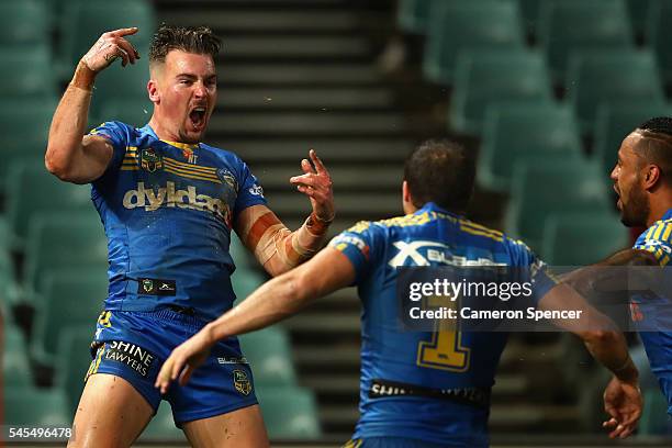 Clint Gutherson of the Eels celebrates scoring a try with team mates during the round 18 NRL match between the Parramatta Eels and the Sydney...