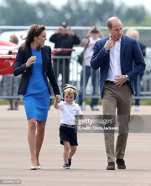 Catherine, Duchess of Cambridge, Prince George and Prince William, Duke of Cambridge arrive for a visit to the Royal International Air Tattoo at RAF...