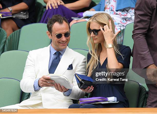 Jude Law and Phillipa Coan attend day eleven of the Wimbledon Tennis Championships at Wimbledon on July 08, 2016 in London, England.