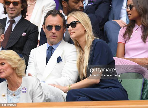 Jude Law and Phillipa Coan attend day eleven of the Wimbledon Tennis Championships at Wimbledon on July 08, 2016 in London, England.