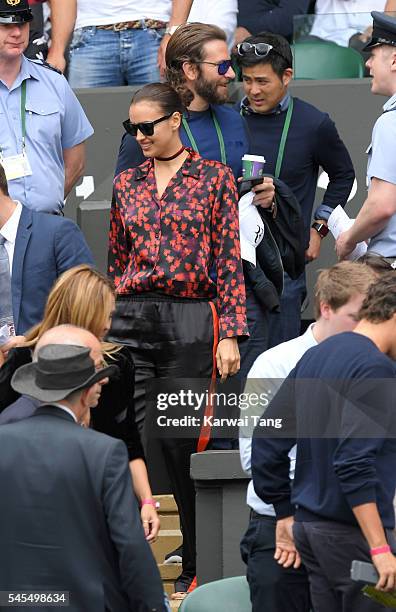 Bradley Cooper and Irina Shayk attend day eleven of the Wimbledon Tennis Championships at Wimbledon on July 08, 2016 in London, England.