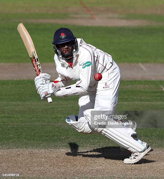 Haseeb Hameed of Lancashire scores four runs during the Specsavers County Championship division one match between Nottinghamshire and Lancashire at...