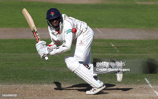 Haseeb Hameed of Lancashire scores four runs during the Specsavers County Championship division one match between Nottinghamshire and Lancashire at...
