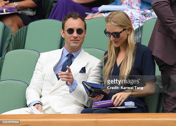 Jude Law and Phillipa Coan attend day eleven of the Wimbledon Tennis Championships at Wimbledon on July 08, 2016 in London, England.