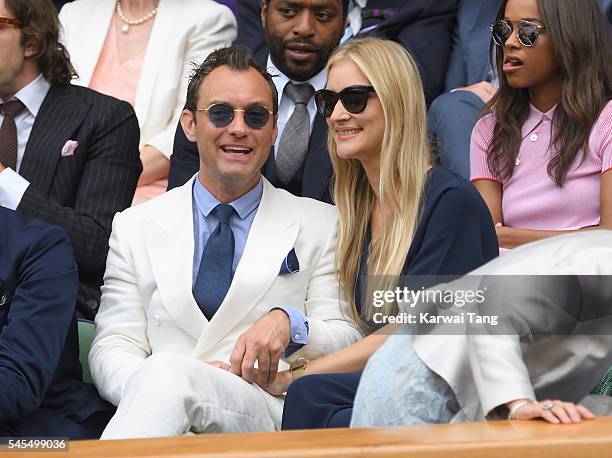 Jude Law and Phillipa Coan attend day eleven of the Wimbledon Tennis Championships at Wimbledon on July 08, 2016 in London, England.