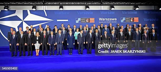 German Chancellor Angela Merkel , Poland's President Andrzej Duda , NATO Secretary General Jens Stoltenberg and US President Barack Obama pose for a...