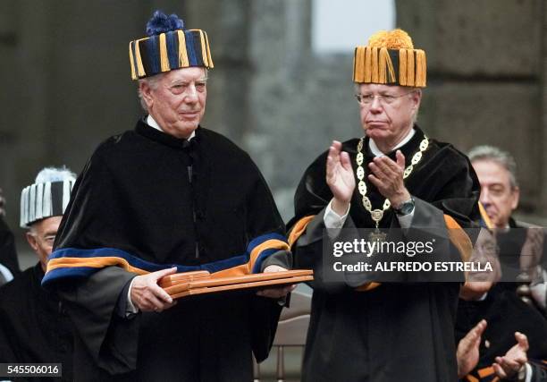 Peruvian writer Mario Vargas Llosa receives his Doctor Honoris Causa title from the rector of the National Autonomus University of Mexico , Jose...