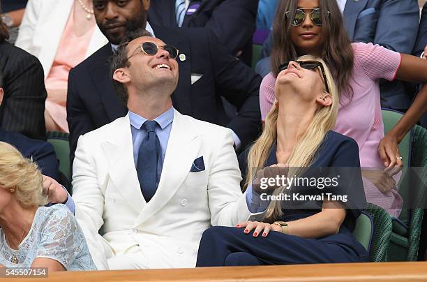 Jude Law and Phillipa Coan attend day eleven of the Wimbledon Tennis Championships at Wimbledon on July 08, 2016 in London, England.