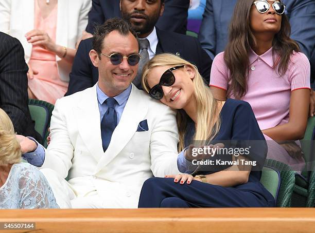 Jude Law and Phillipa Coan attend day eleven of the Wimbledon Tennis Championships at Wimbledon on July 08, 2016 in London, England.