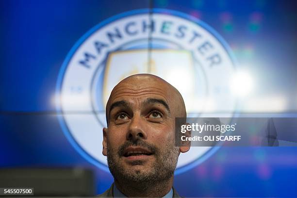 Manchester City's Spanish football coach Pep Guardiola addresses the media during a press conference at the City Football Academy in Manchester,...