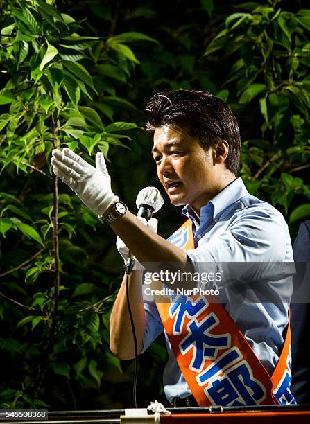 Taichiro Motoe a candidate from Liberal Democratic Party delivers his campaign speech during the Upper House election campaign outside of...