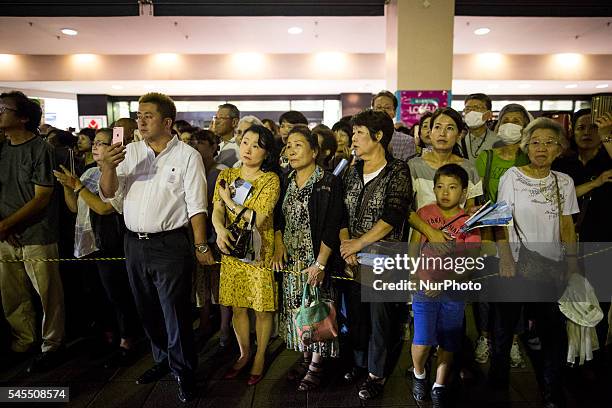 Supporters watches Shinjir Koizumi of Liberal Democratic Party delivers his campaign speech to support candidate Taichiro Motoe during the Upper...