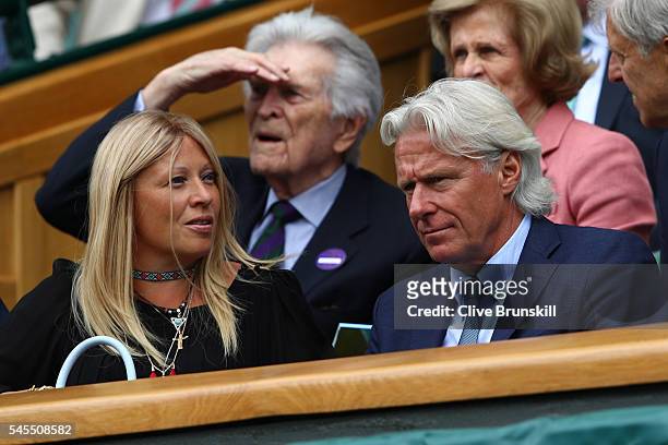 Bjorn Borg and Patricia Borgwatches on as Roger Federer of Switzerland plays Milos Raonic of Canada in the Men's Singles Semi Final match on day...