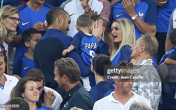 Dimitri Payet of France, his son Noa Payet and his wife Ludivine Payet celebrate the victory following the UEFA Euro 2016 semi-final match between...