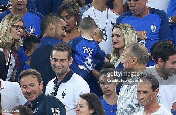 Dimitri Payet of France, his son Noa Payet and his wife Ludivine Payet celebrate the victory following the UEFA Euro 2016 semi-final match between...