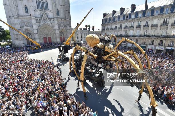 Kumo, a mechanical spider made of wood and steel by "Les Machines de L'Ile" factory is presented to the public for the first time in front of the...