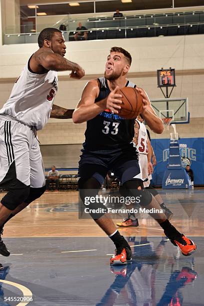 Mitch McGary of the Oklahoma City Thunder drives to the basket against the Miami Heat during the Orlando Summer League on July 8, 2016 at Amway...