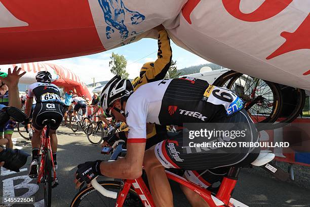 Luxemburg's Frank Schleck and Spain's Haimar Zubeldia pass under the deflated arch of the last kilometer of the 162,5 km seventh stage of the 103rd...