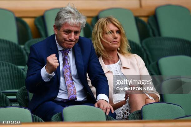 Speaker of the House of Commons John Bercow gestures next to his wife Sally in the royal box before the start of the men's singles semi-final match...