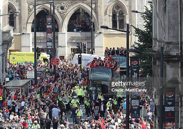 Fans cheer as they line Westgate Street to welcome the Wales team home following their exit from the Euro 2016 championships, on July 8, 2016 in...