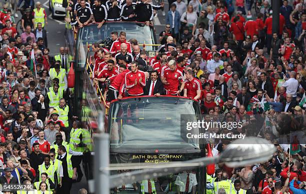 Fans cheer as they line Westgate Street to welcome the Wales team home following their exit from the Euro 2016 championships, on July 8, 2016 in...