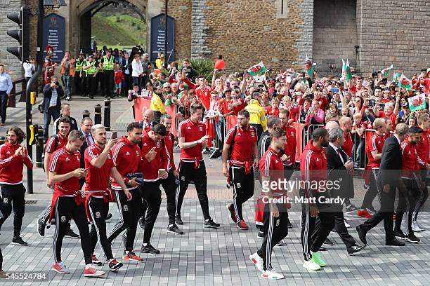 The Welsh team walk out of Cardiff Castle and are welcomed home by fans following their exit from the Euro 2016 championships, on July 8, 2016 in...