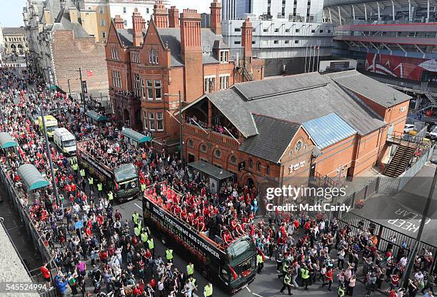 Fans cheer as they line Westgate Street to welcome the Wales team home following their exit from the Euro 2016 championships, on July 8, 2016 in...