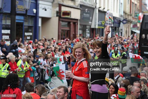 The Welsh team walk out of Cardiff Castle and are welcomed home by fans following their exit from the Euro 2016 championships, on July 8, 2016 in...