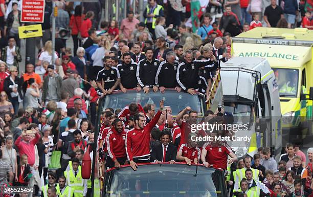 Fans cheer as they line Westgate Street to welcome the Wales team home following their exit from the Euro 2016 championships, on July 8, 2016 in...